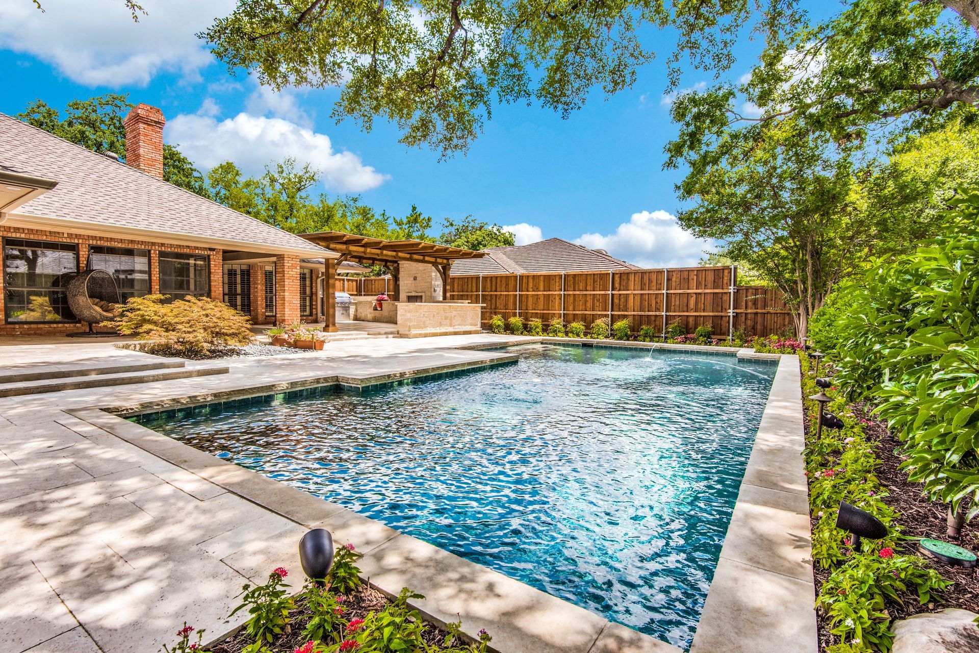  Plano home remodel  large swimming pool in the backyard of a house.