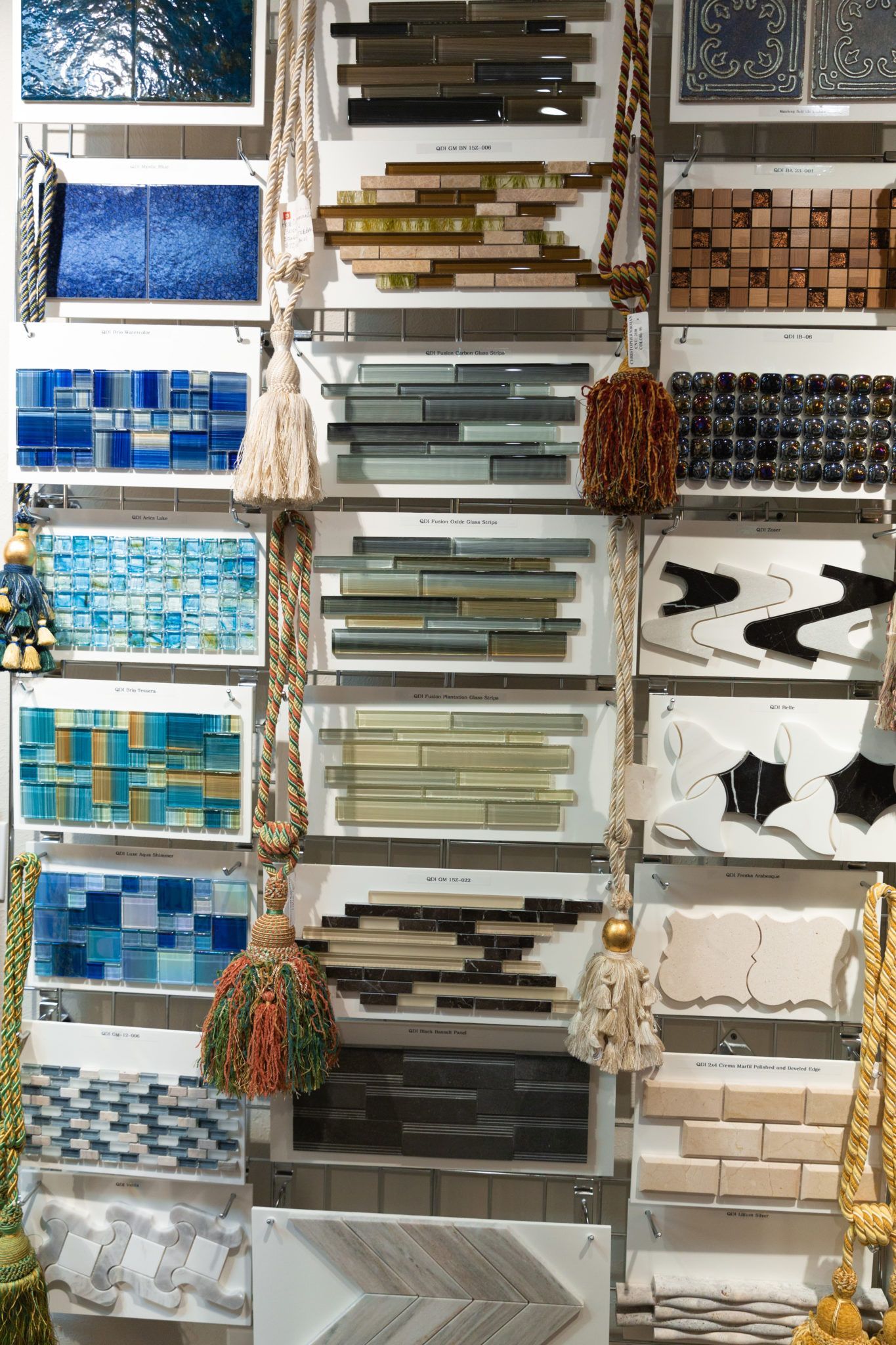 A wall filled with lots of different types of tiles.