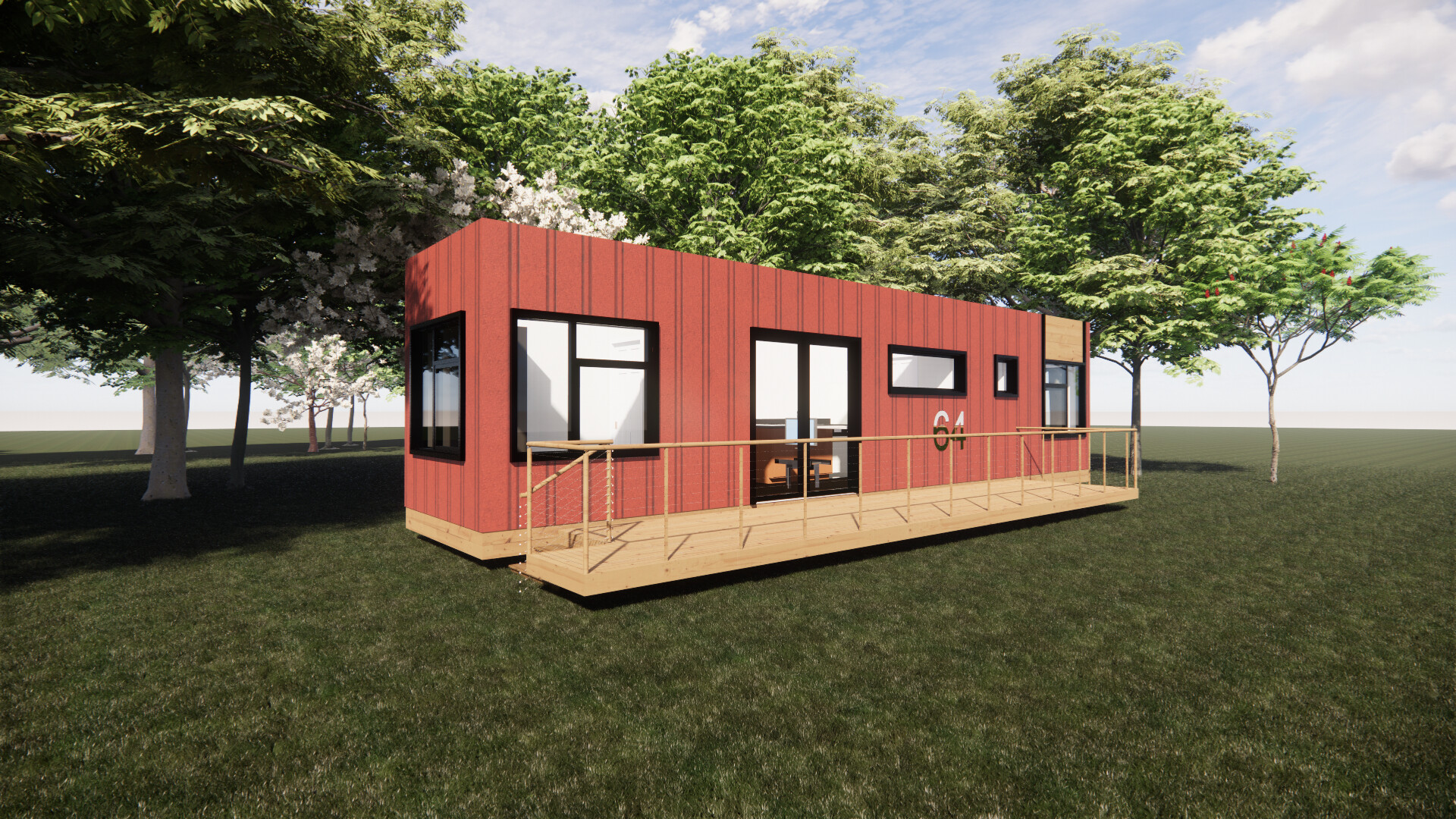 A red shipping container house with a wooden deck is sitting in the middle of a field surrounded by trees.