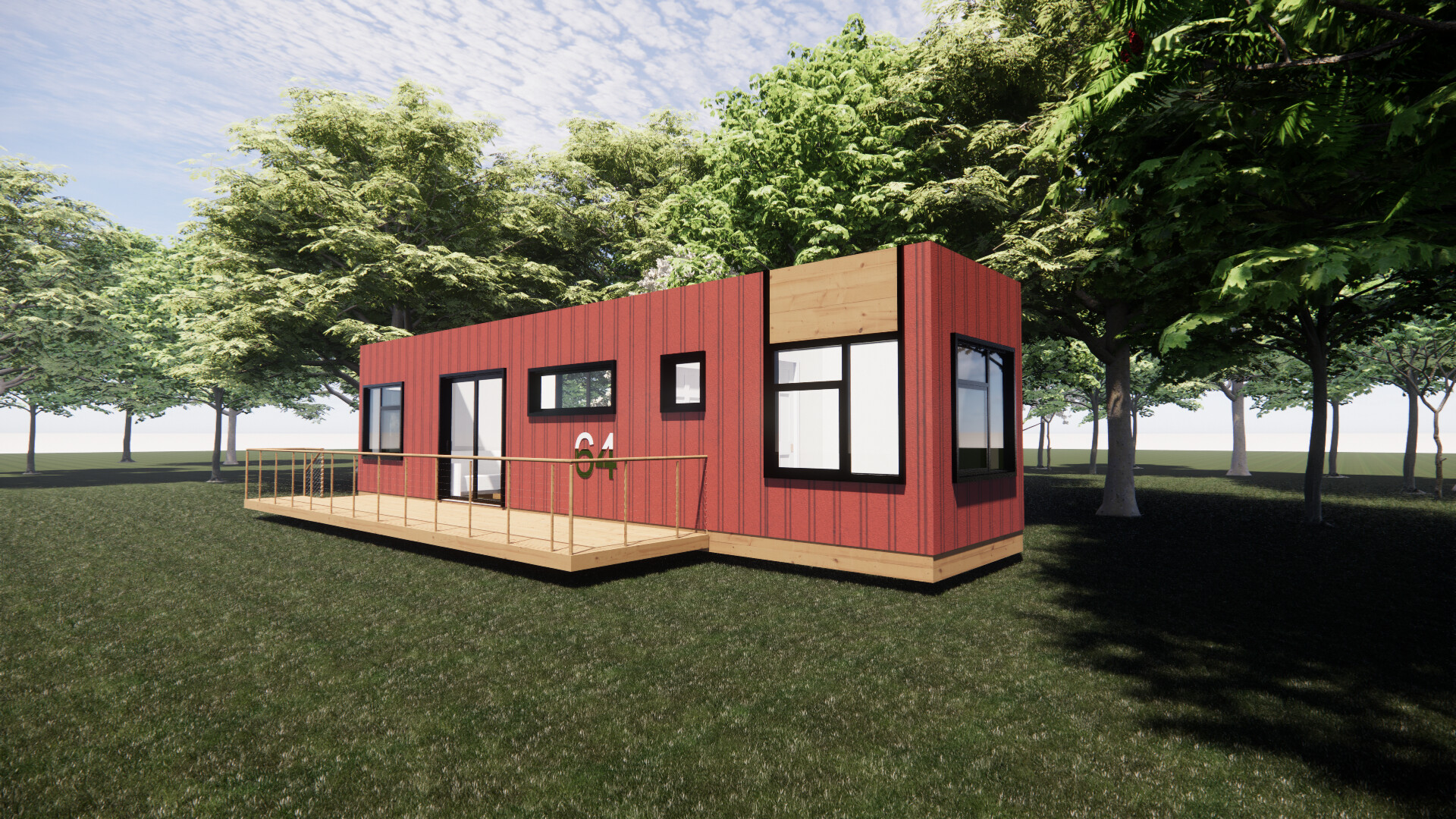 A red shipping container house is sitting on top of a lush green field surrounded by trees.