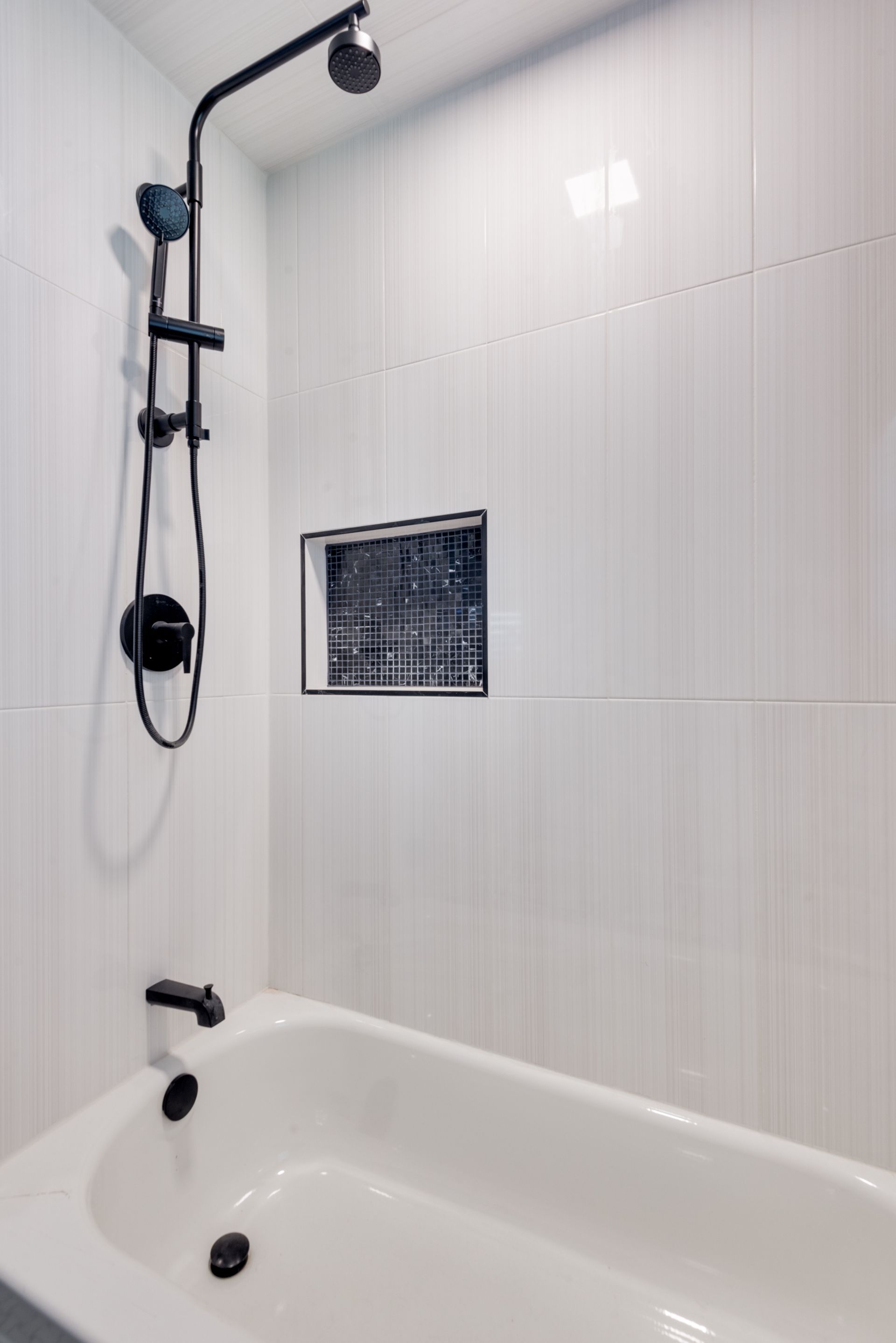 A bathroom remodel with a bathtub and a shower.