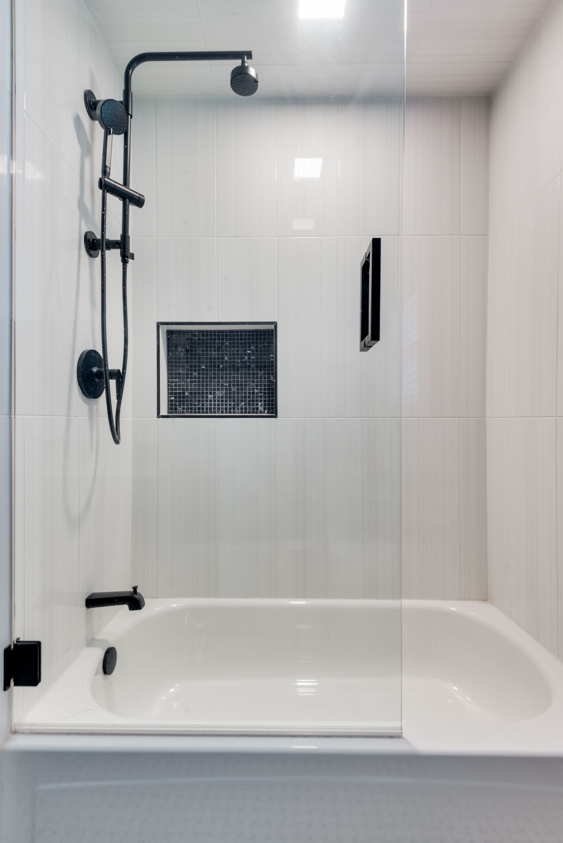 A bathroom remodel with a bathtub and a shower.