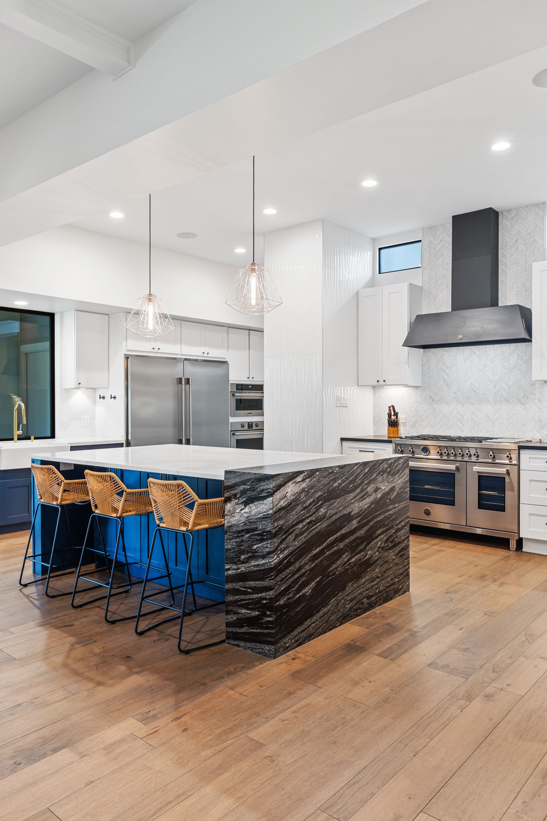 There is a large island in the middle of the kitchen.