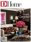 A living room filled with furniture and flowers on the cover of a magazine.