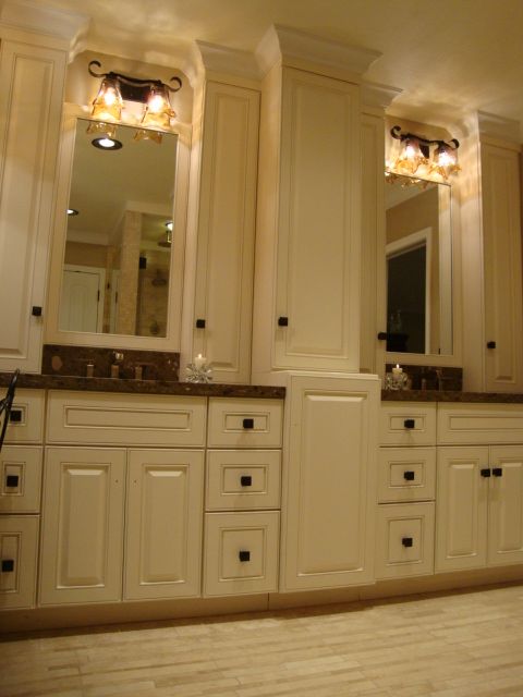 A bathroom with two sinks and two mirrors
