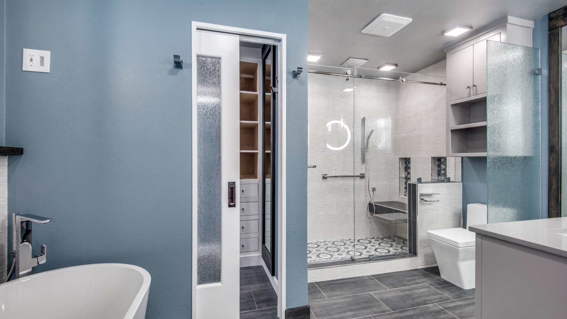 Blue-walled bathroom with a sliding door leading to a closet, shower, and toilet.