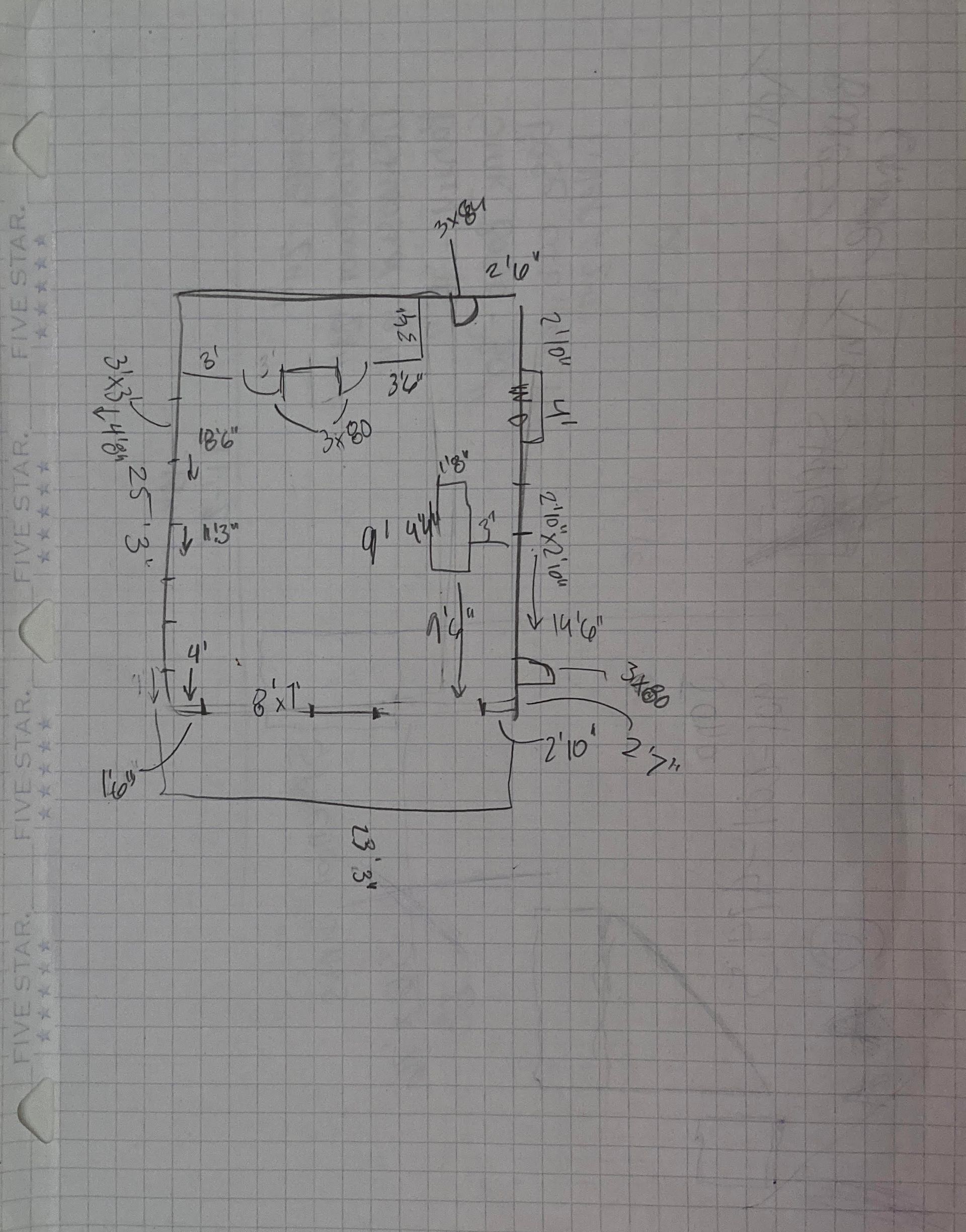 A black and white drawing on a piece of graph paper