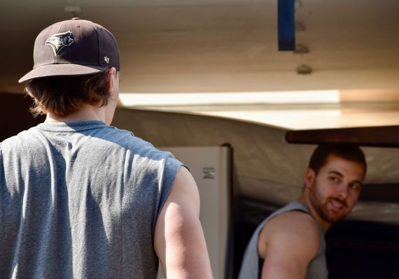 two men moving furniture