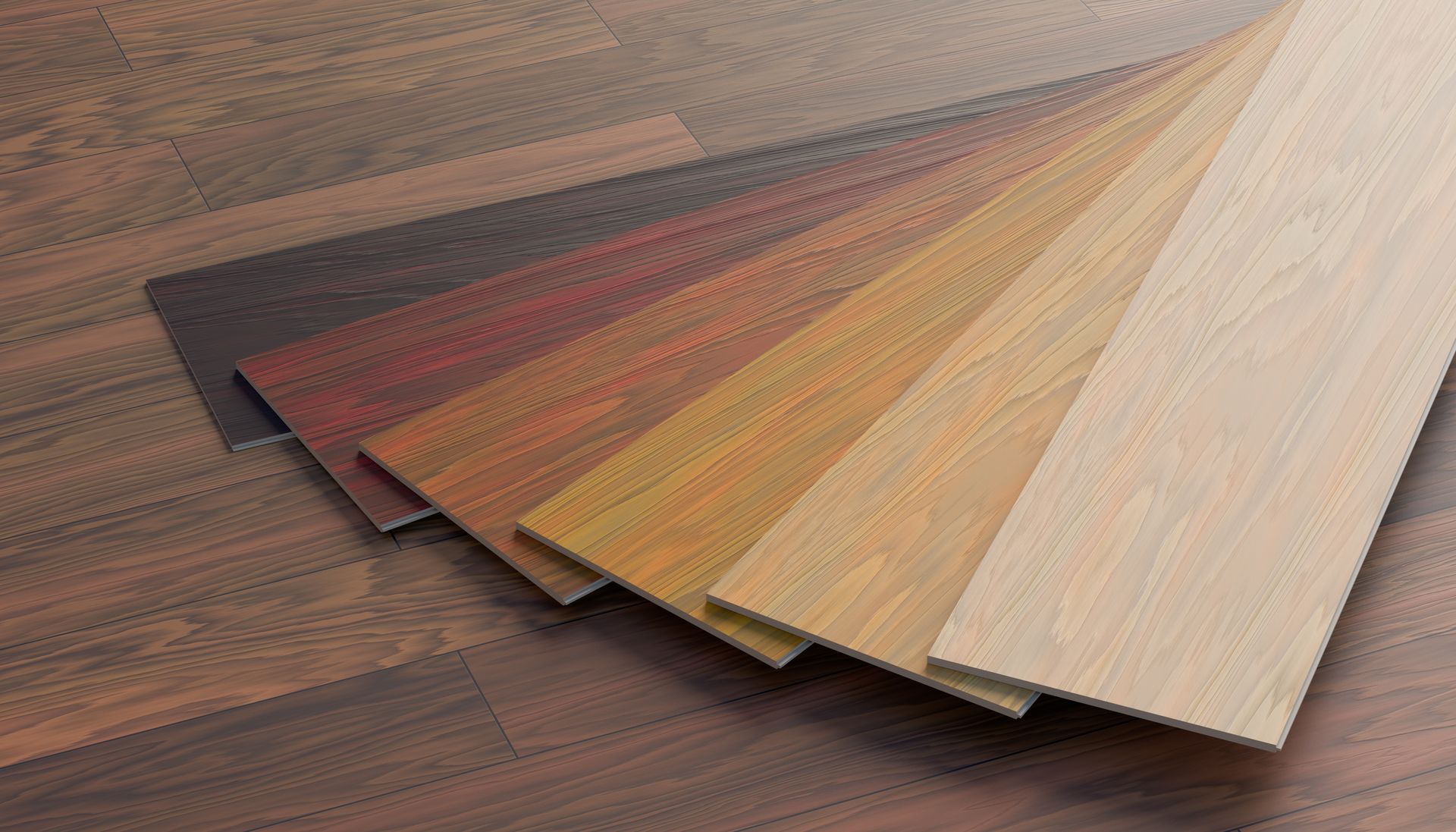 Four wooden cutting boards of varying sizes and wood grains arranged on a wood surface.