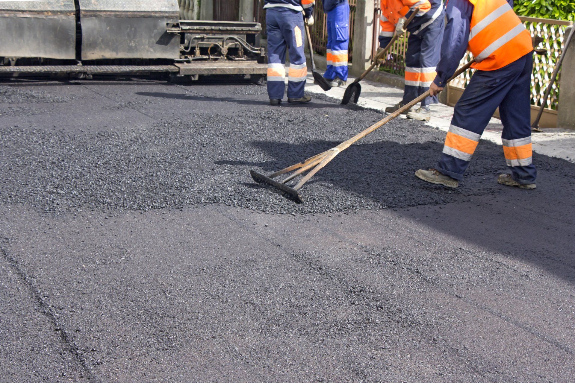 Workers Cleaning The Asphalt — Vacaville, CA — American Asphalt