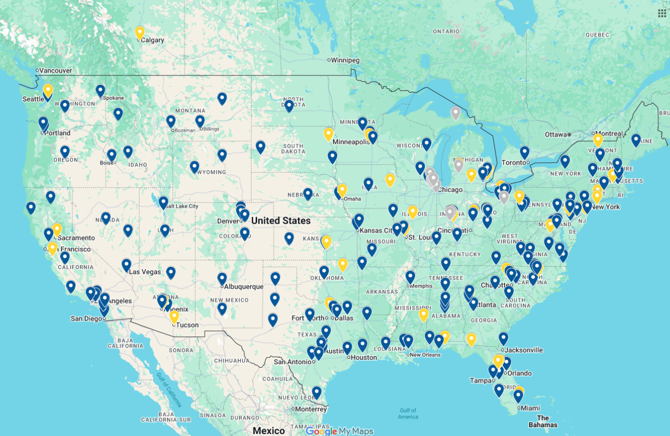 A map of the United States displaying numerous blue and yellow location pins marking various sites across the country.
