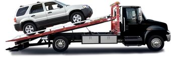 A white suv is being towed by a tow truck.
