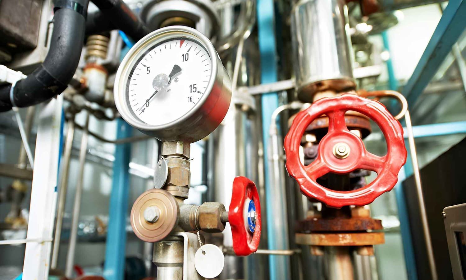 A Close Up Of A Pressure Gauge And A Red Valve In A Factory — Ashley Chick Plumbing In Baranduda, VIC