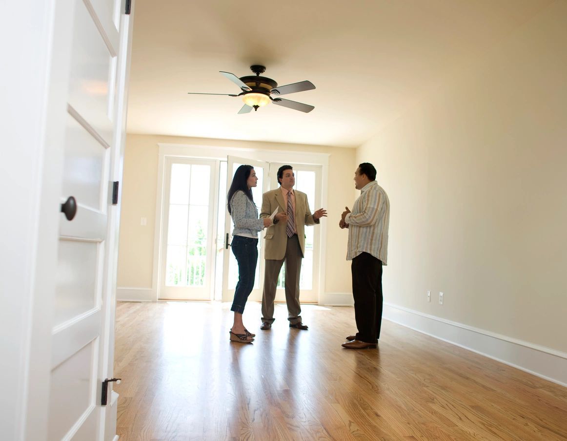 Three People are talking inside the House - Milton, WI - Home Pro Inspection Services Inc.