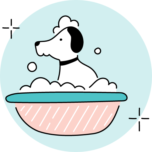 A dog is taking a bath in a bowl of soap.