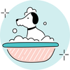 A dog is taking a bath in a bowl of soap.