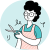 A woman is holding a pair of scissors in her hands.