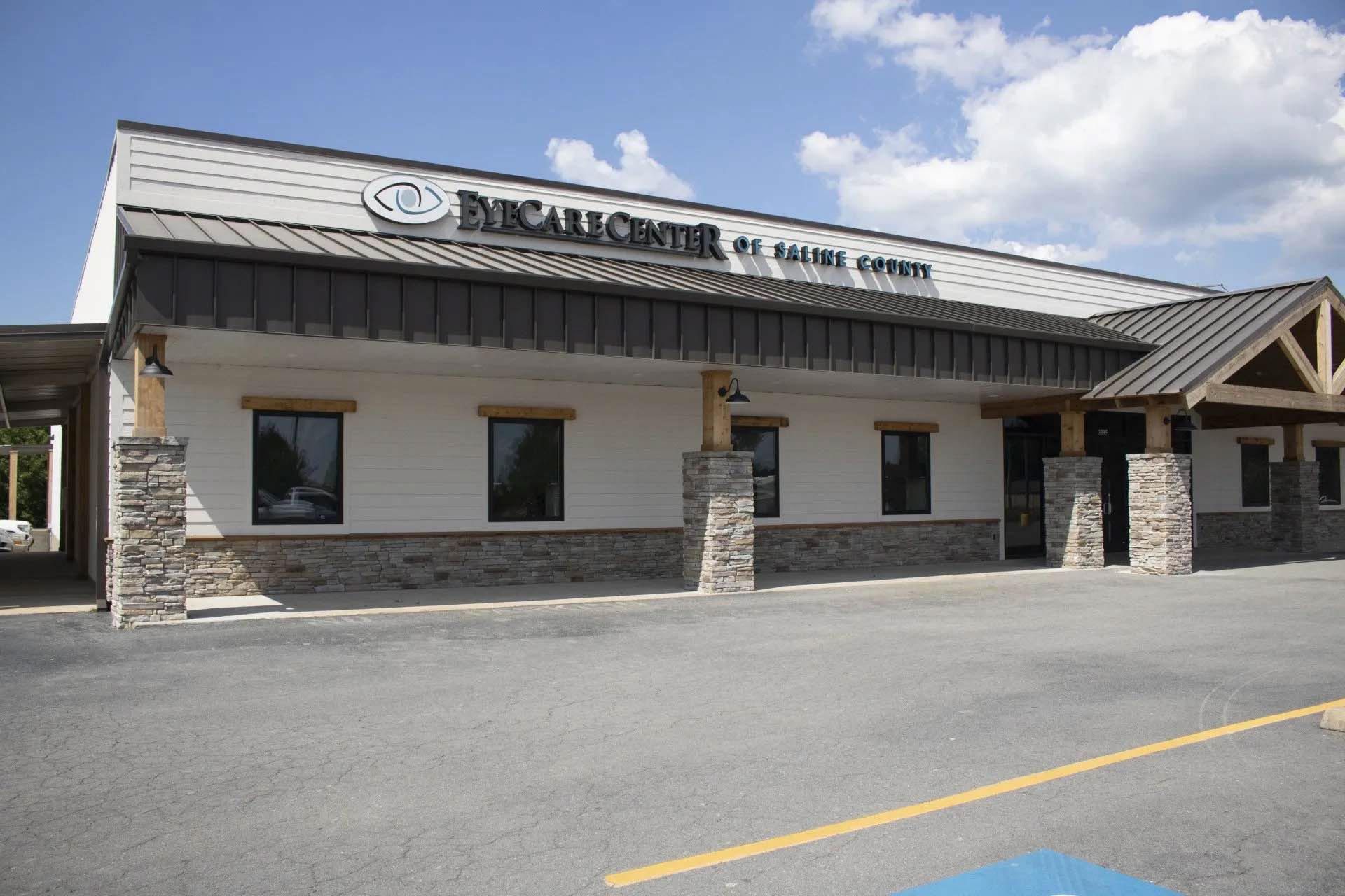 A large building with a handicapped parking spot in front of it