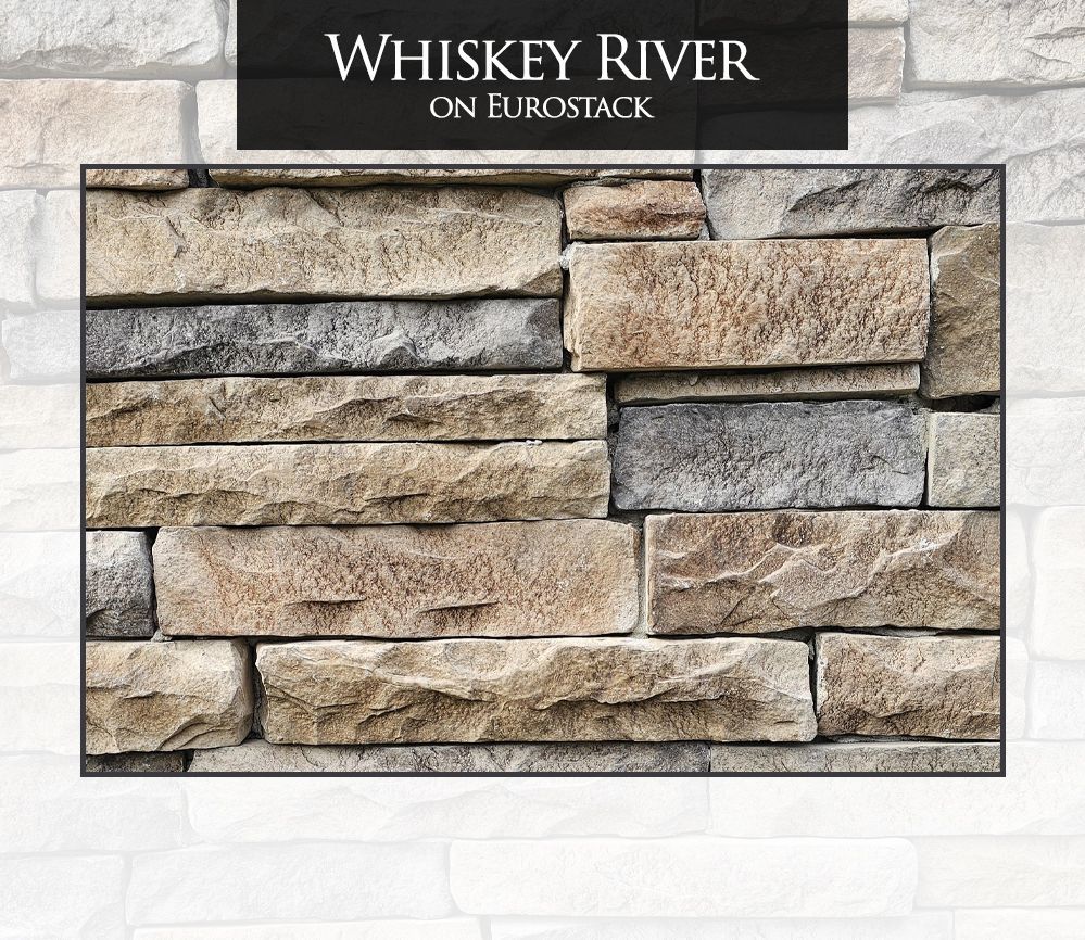 A picture of a stone wall with the words whiskey river on it