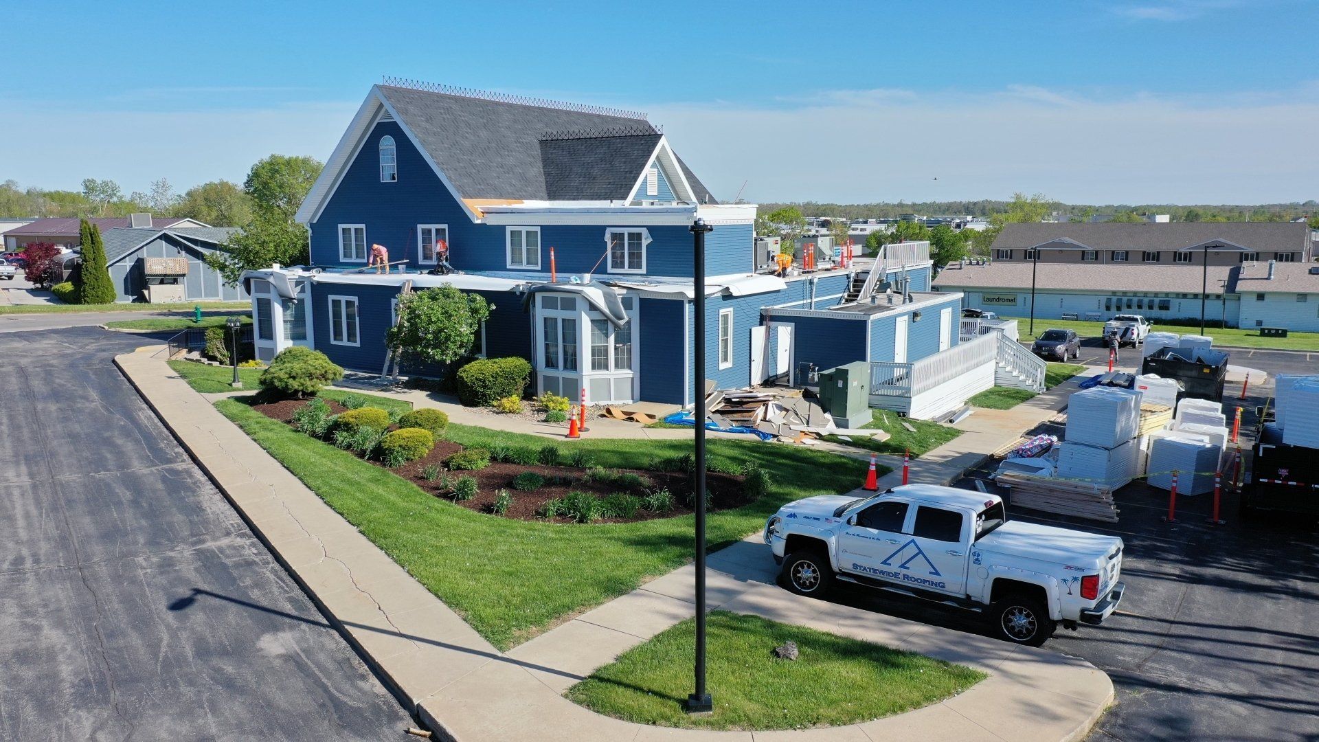 an aerial view of a house with a truck parked in front of it .
