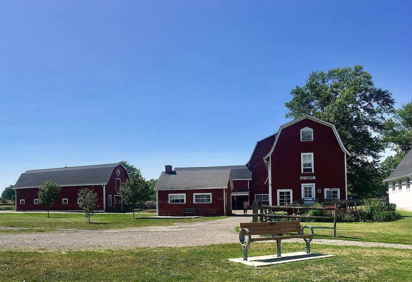 Photo Credit: Andrew Carrotflower, https://commons.wikimedia.org/wiki/File:Knox_Farm_State_Park,_Town_of_Aurora,_New_York_-_20190723.jpg A row of cars are parked on the side of a city street in Franklin, Tennessee