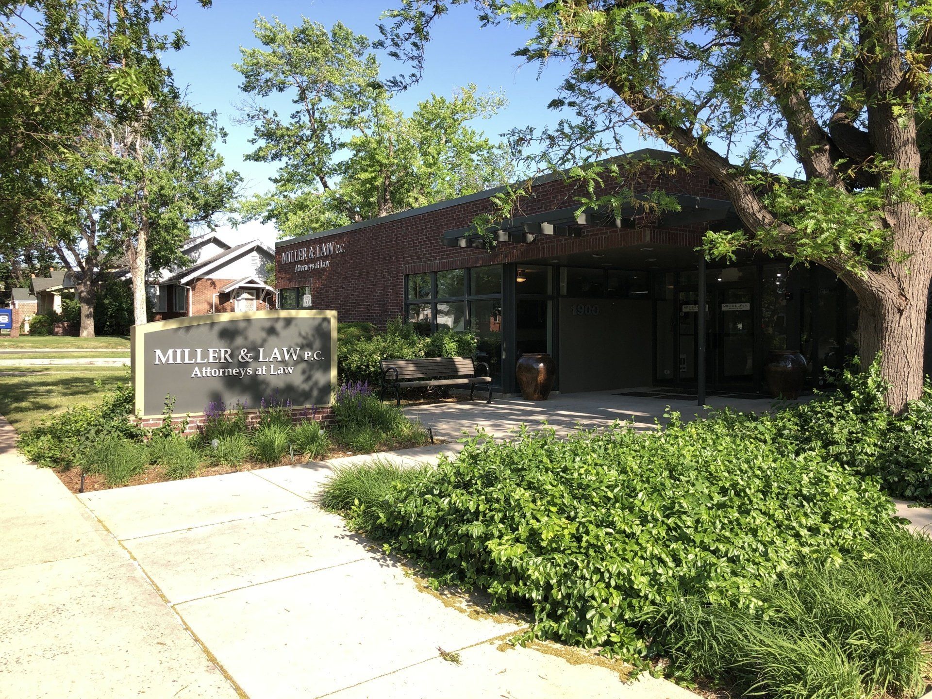 a brick building with a sign in front of it