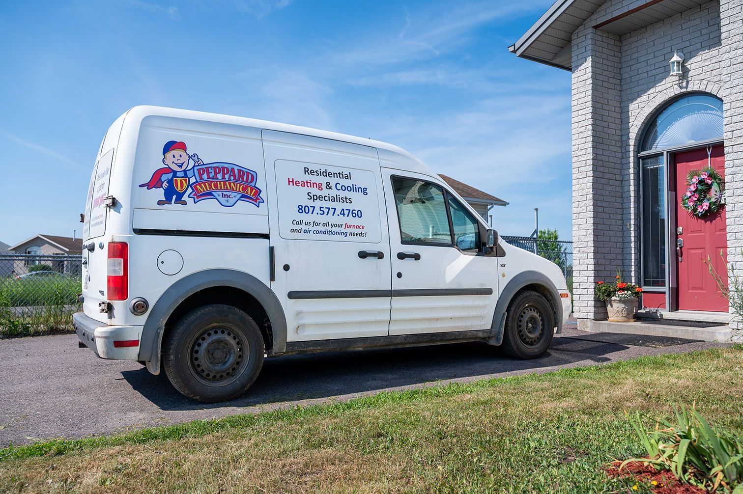 D. Peppard Mechanical van parked in front of a customer home.