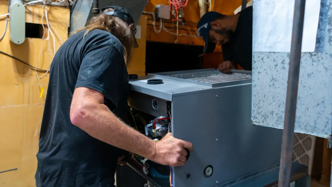 D. Peppard technician installing a new GE furnace. 