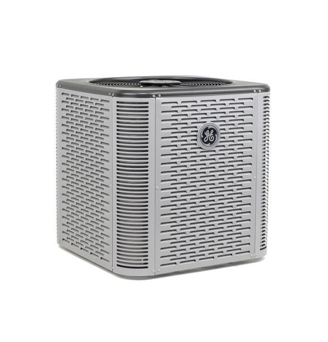 Silver GE air purifier with perforated sides on a white background