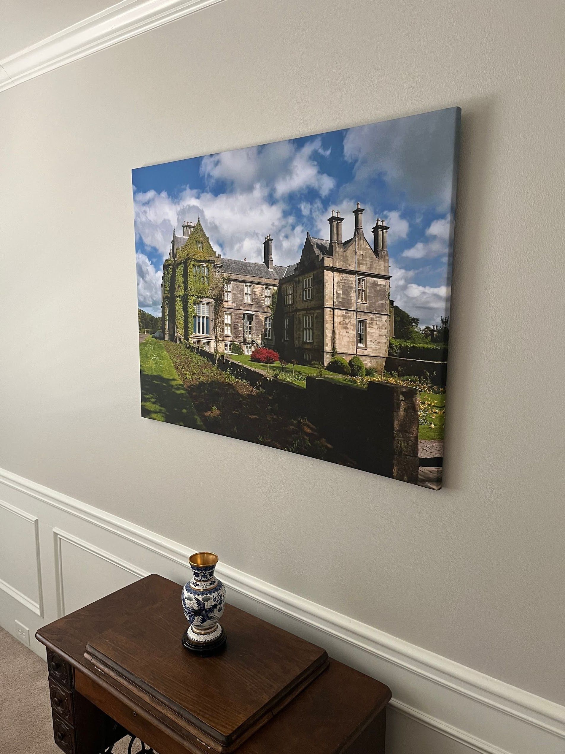 Correctly sized canvas print hanging above a side table in an Atlanta living room