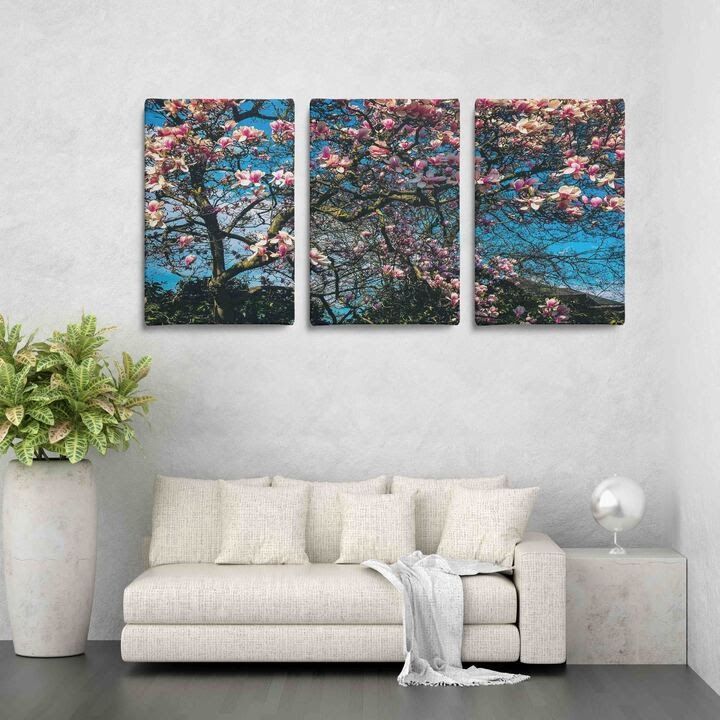 Triptych floral wall art panels from Atlanta Canvas & Print above a cream sofa