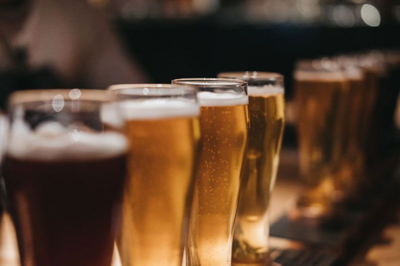 pints of beer in various shades sitting on a table
