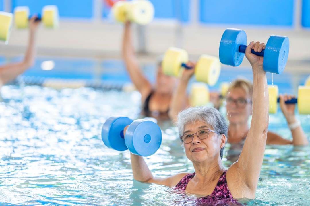 women doing water workouts in a pool