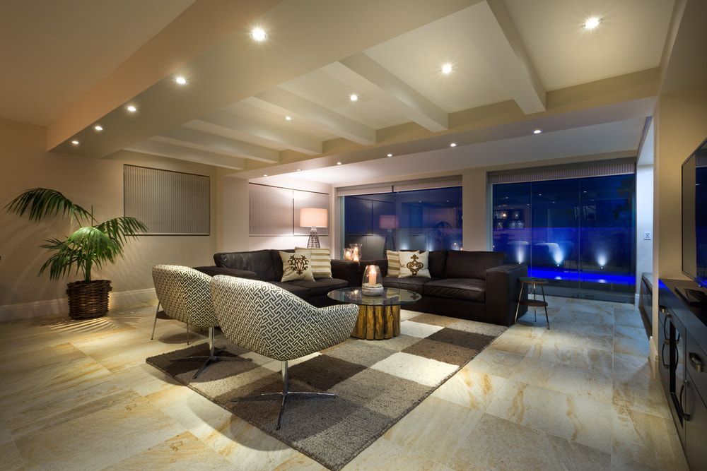 Living Room With A Couch Chairs And A Television — Pro Vision Property Inspections In Merewether, NSW