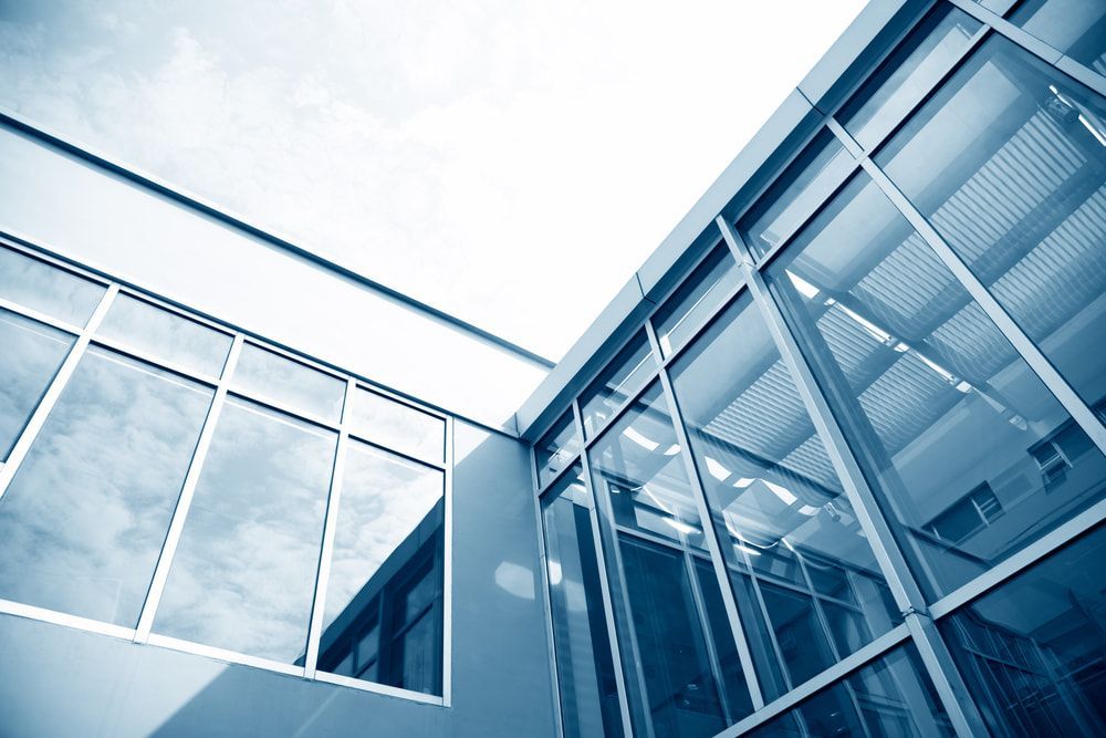 Looking Up At A Building With Lots Of Windows — Pro Vision Property Inspections In Merewether, NSW