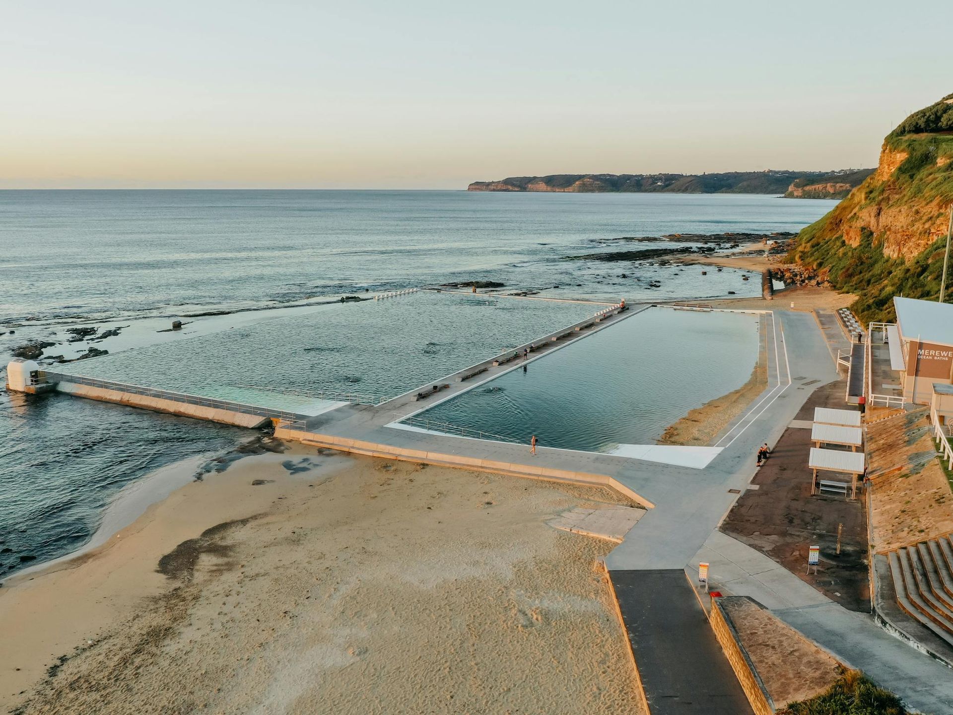 Aerial View Of A Beach With A Soccer Field And A City — Pro Vision Property Inspections In Merewether, NSW