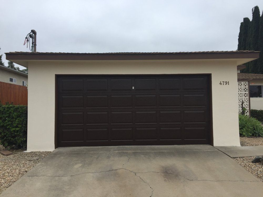 A brown garage door with the number 4191 on it