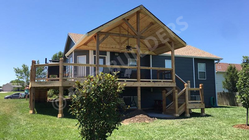 a house with a large wooden deck with a timber roof 