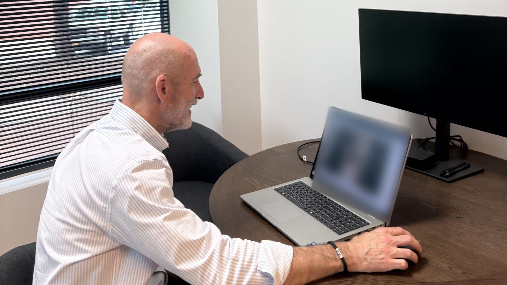 Dr. Mike McClincy using a laptop for a telemedicine appointment