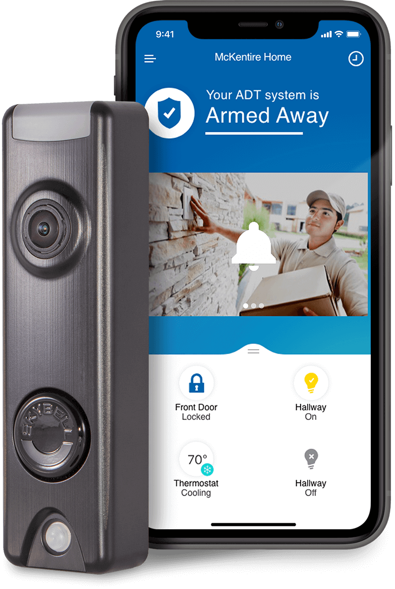 A cell phone is sitting next to a security camera.