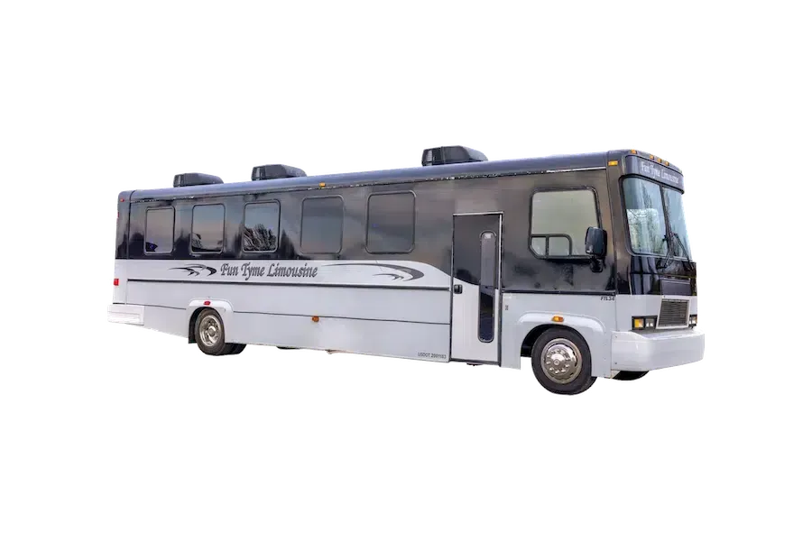 Grey and black tour bus with the words "Van Dyke Limousines" on the side, isolated on a white background.