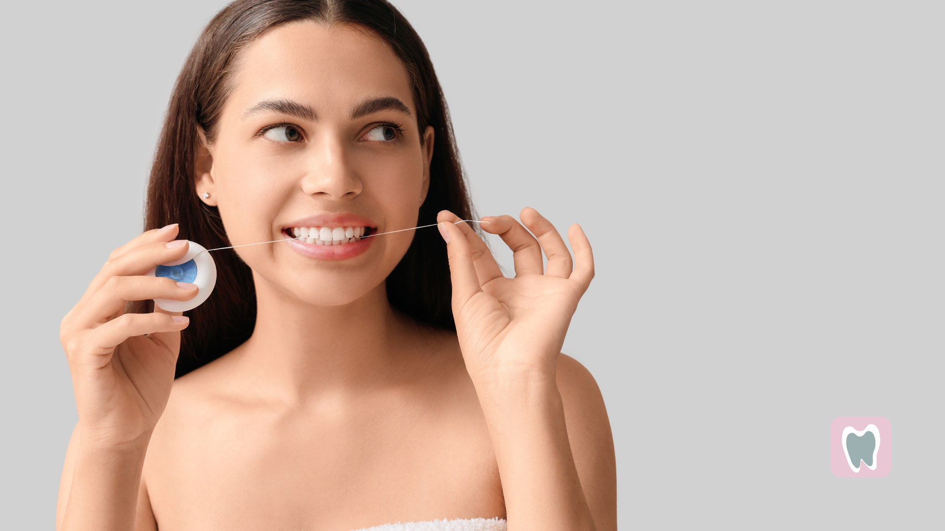 A close-up of a person smiling, showcasing straight, white teeth and healthy gums.