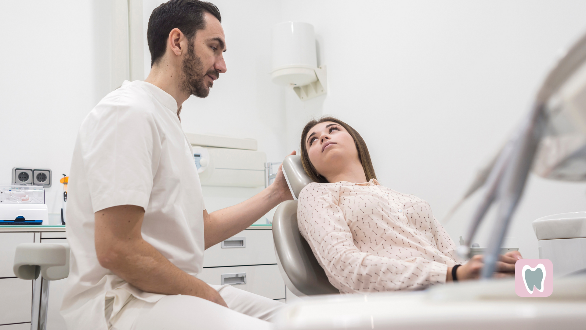 A dentist is examining a woman 's teeth in a dental office.
