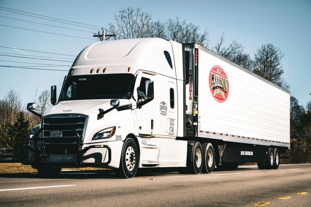 Driver Propped against his truck