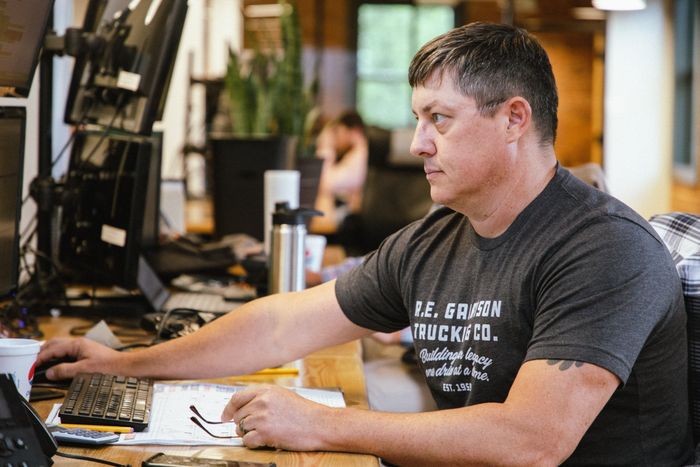 R.E. Garrison Employee working at their desk
