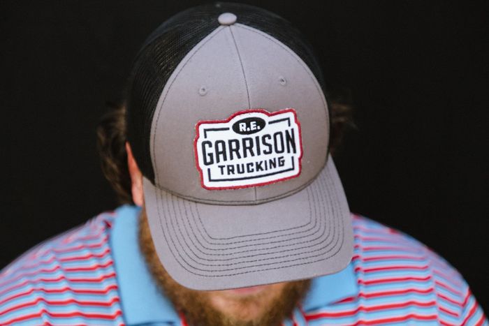 Man wearing an R.E. Garrison Hat Looking Down with face covered by hat bill