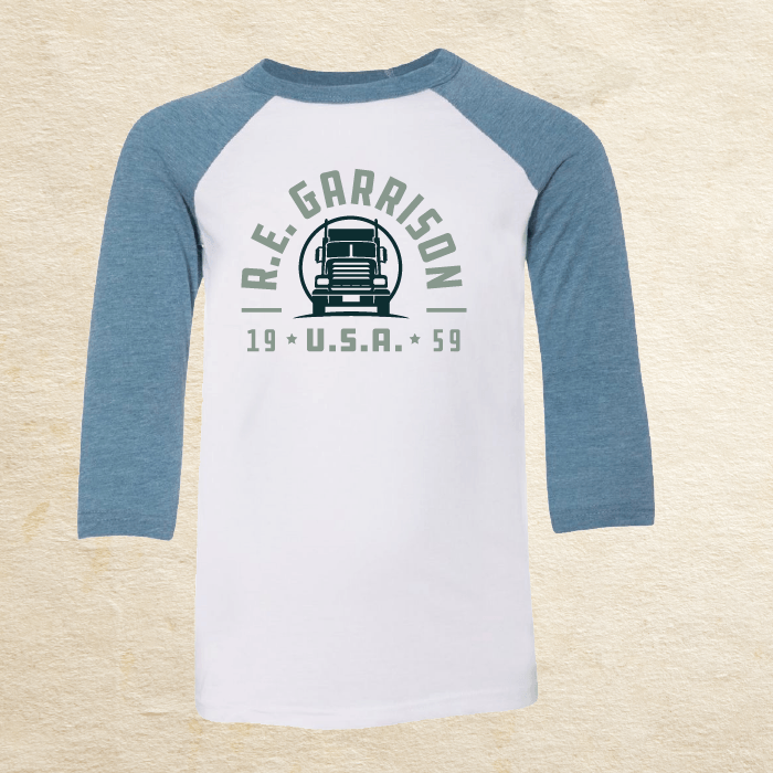 White shirt with blue 3/4th sleeves with R.E. Garrison text surrounding a cartoon big rig