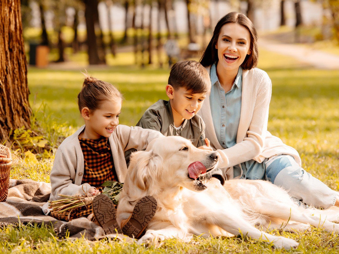 Happy Family With Their Dog
