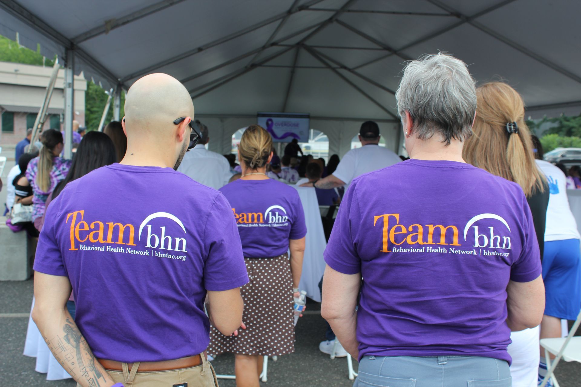Team members from BHN wear their purple 