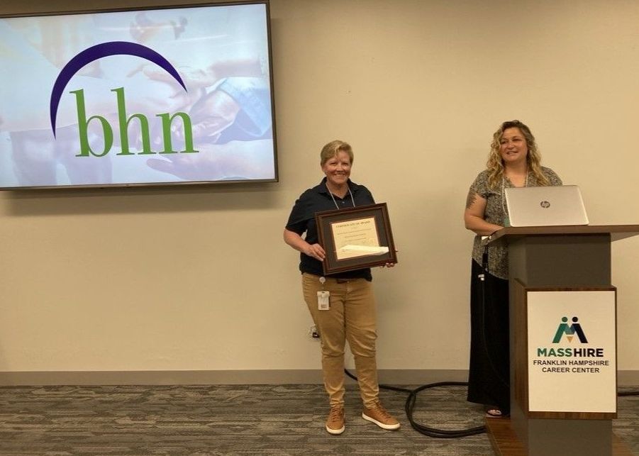 Marcie Lyons and Lisa Yin accept the 2025 MassHire Workforce Development Award.